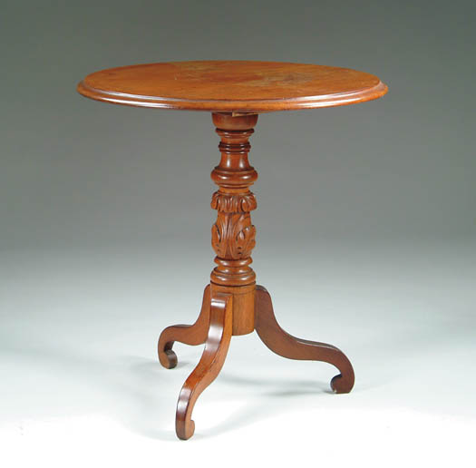 Appraisal: EARLY VICTORIAN WALNUT CARVED TIP TOP STAND The round molded