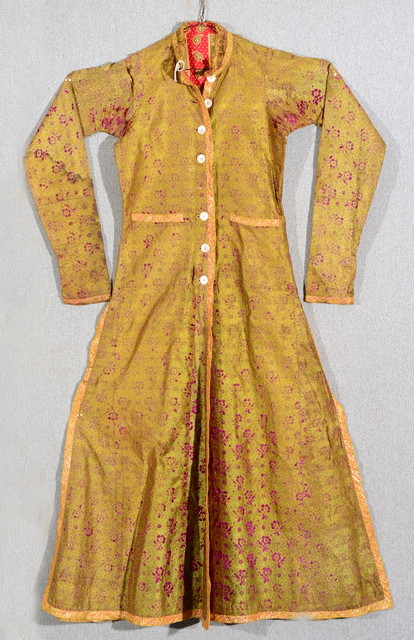 Appraisal: A CHINESE GREEN SILK GOWN high necked with eight buttons