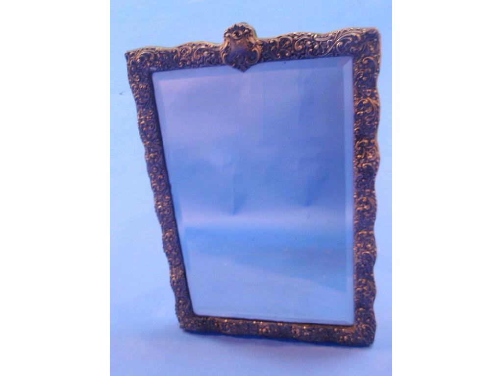 Appraisal: A late Victorian silver framed rectangular bevelled mirror with easel