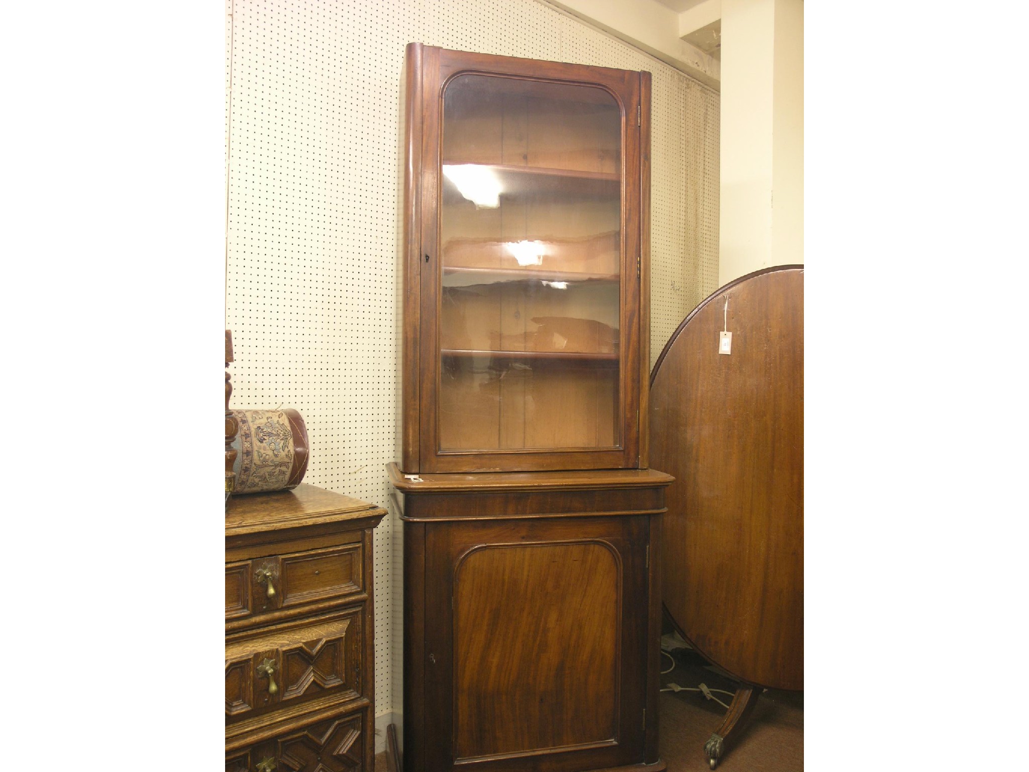 Appraisal: An early Victorian mahogany bookcase single glazed door enclosing three