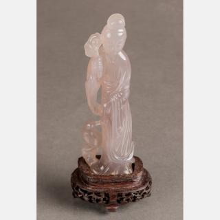 Appraisal: A Chinese Carved Agate Figure of Guanyin on a Carved