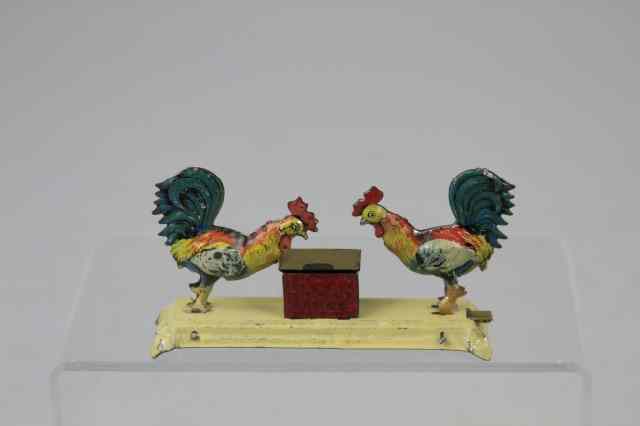 Appraisal: PECKING ROOSTERS PENNY TOY Meier Germany lithographed tin depicts two