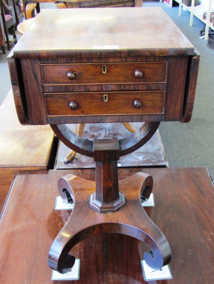 Appraisal: A William IV rosewood drop flap work table with a