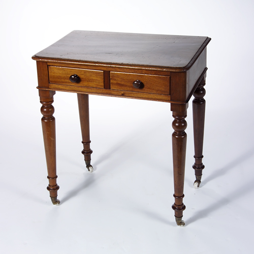 Appraisal: Victorian walnut two drawer writing table with wooden pulls and