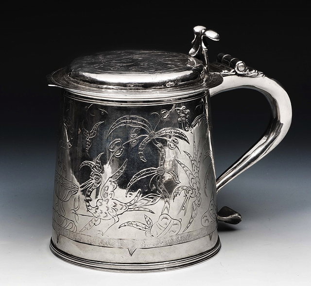 Appraisal: A CHARLES II SILVER LIDDED TANKARD with tapering sides engraved