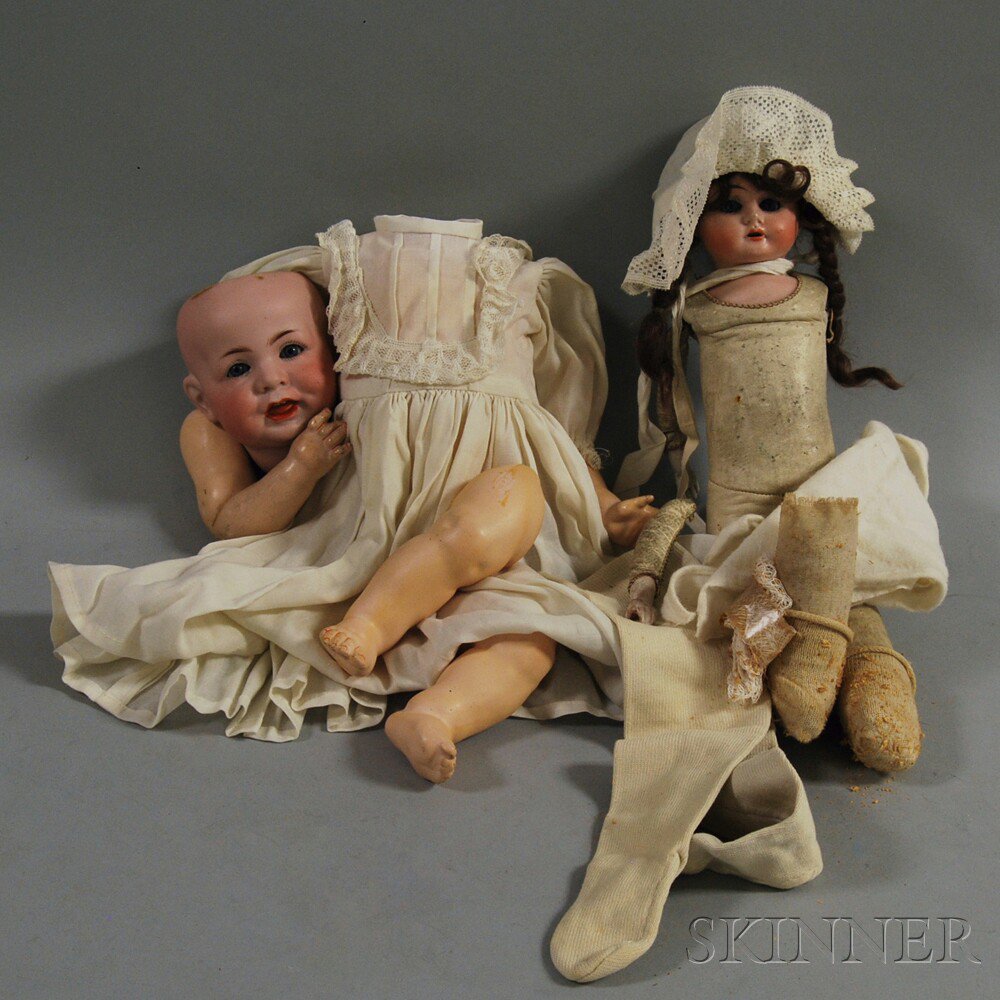 Appraisal: Two Dolls an Ernst Heubach bisque shoulder head doll with