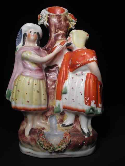 Appraisal: th century English Staffordshire spill vase depicting two figures Measures