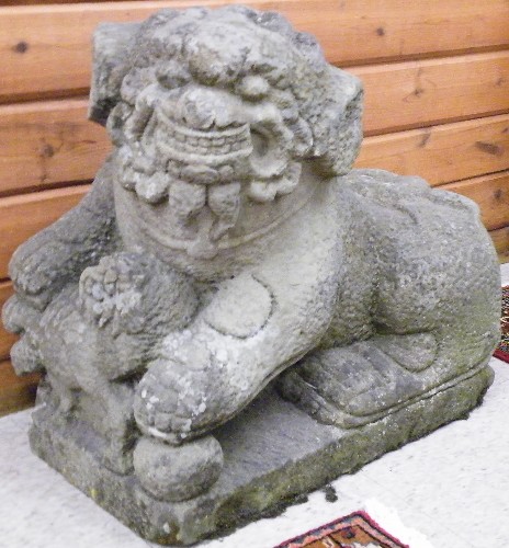 Appraisal: AN EARLY PAIR OF CHINESE CARVED SANDSTONE FOO DOGS male