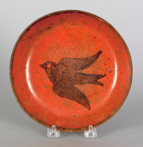 Appraisal: Pennsylvania redware plate th c with bird decoration dia