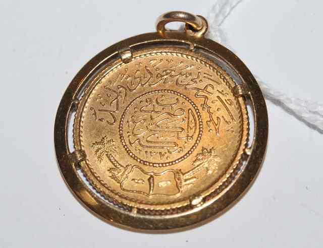 Appraisal: A MIDDLE EASTERN GOLD COIN in a gold mount