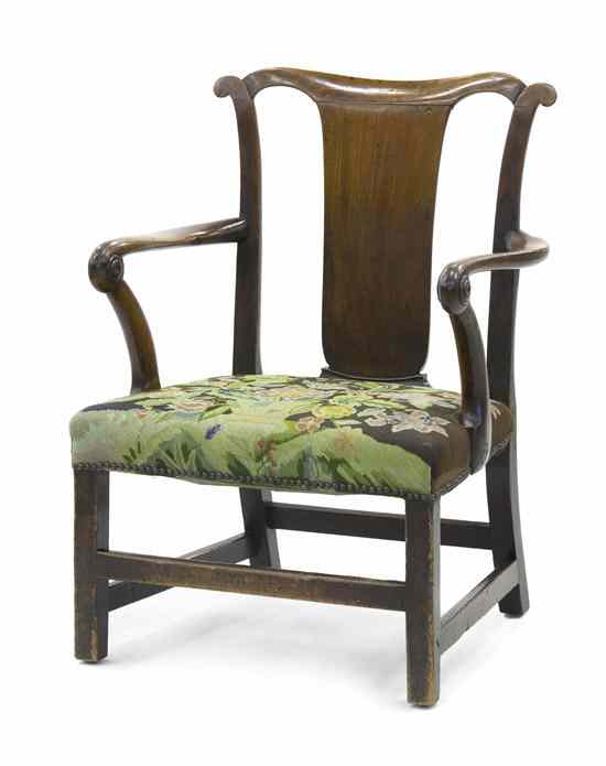 Appraisal: A George II Style Walnut Open Armchair having a shaped