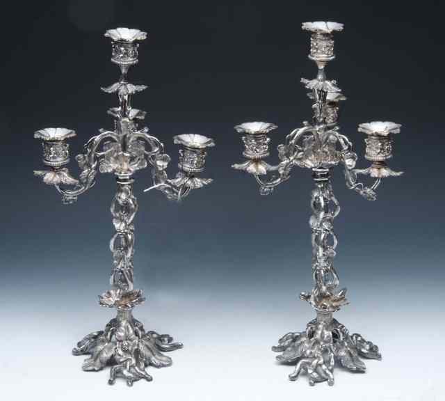 Appraisal: A PAIR OF VICTORIAN STYLE SILVER PLATED THREE BRANCH CANDELABRA