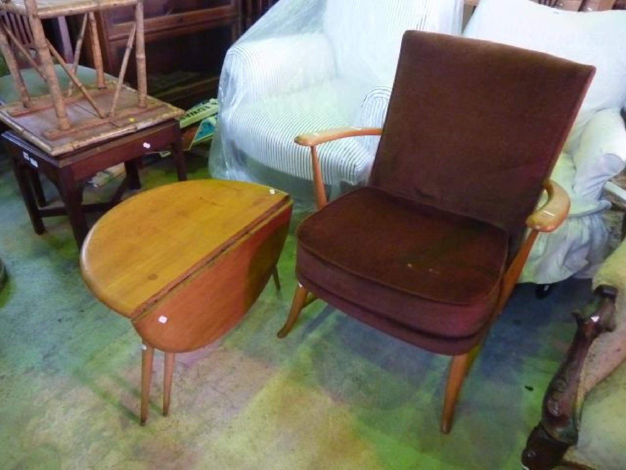 Appraisal: An Ercol beechwood armchair with brown dralon upholstery plus matching