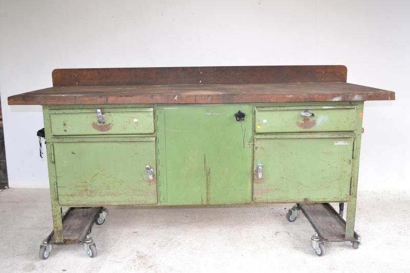 Appraisal: A LARGE INDUSTRIAL GREEN PAINTED WORKBENCH TROLLEYS NOT INCLUDED A