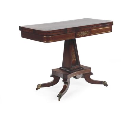 Appraisal: A Regency rosewood and brass inlaid card table the foldover