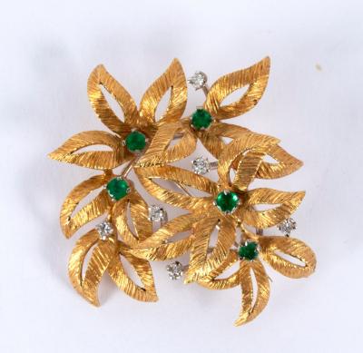 Appraisal: A gem set brooch by Cropp Farr of multiple flowerhead