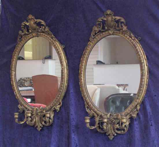 Appraisal: A pair of th century carved giltwood and gesso oval