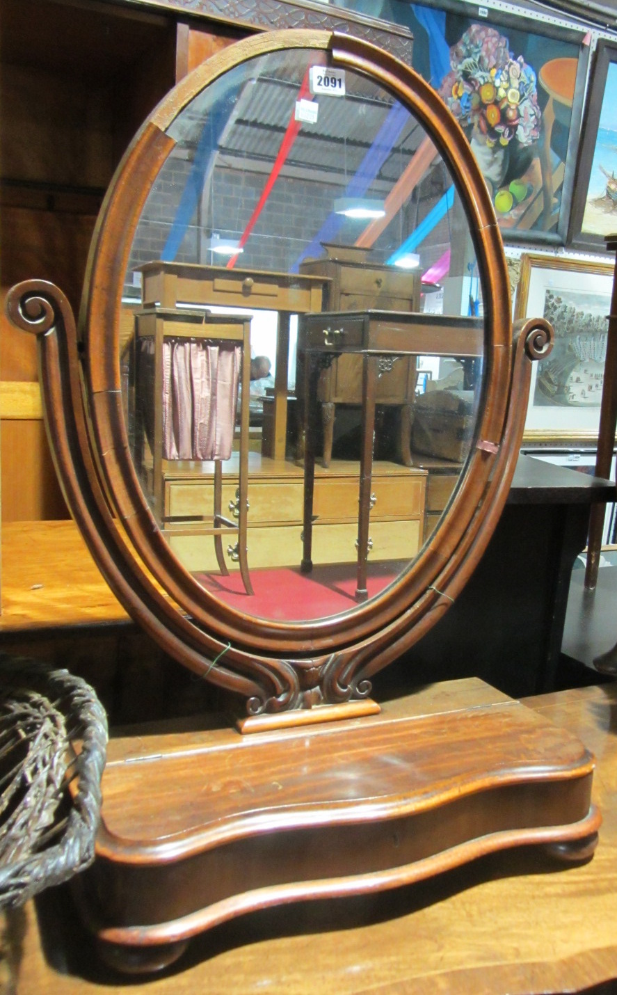 Appraisal: A Victorian toilet mirror with glove box together with a