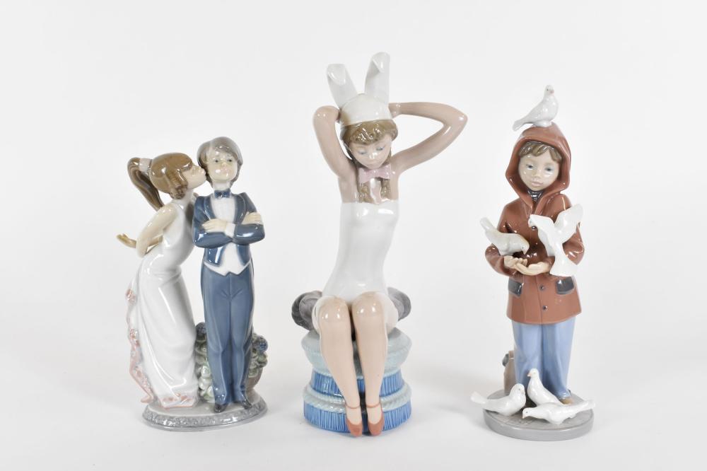 Appraisal: THREE LLADRO PORCELAIN FIGURESAll marked Comprising a show girl in