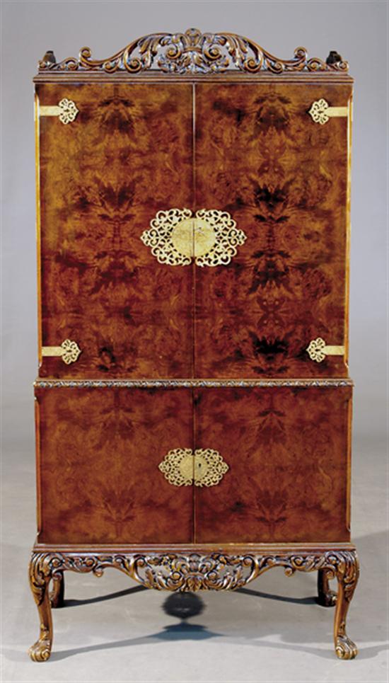 Appraisal: Continental walnut and burl drinks cabinet pierce-carved cornice over cabinet