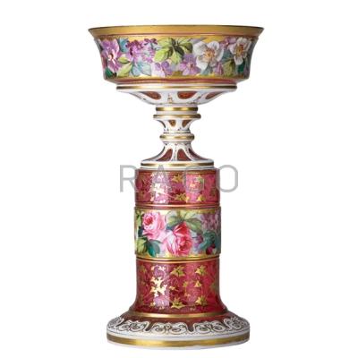 Appraisal: BOHEMIAN CRANBERRY OVERLAY COMPOTE Hand-painted flowers and gilded leaf decoration