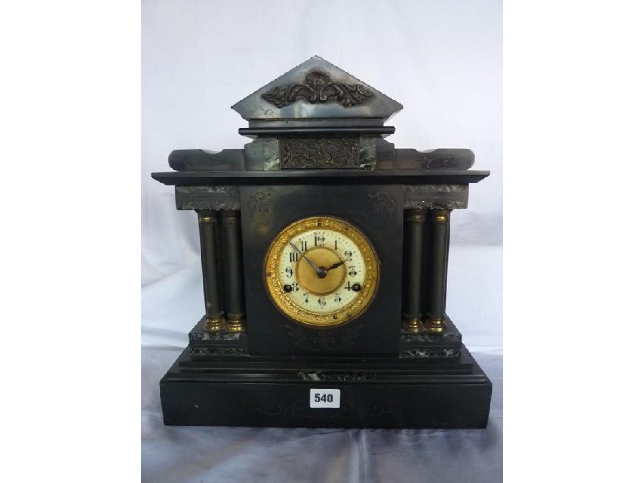 Appraisal: A Victorian black slate and brass classical mantle clock with