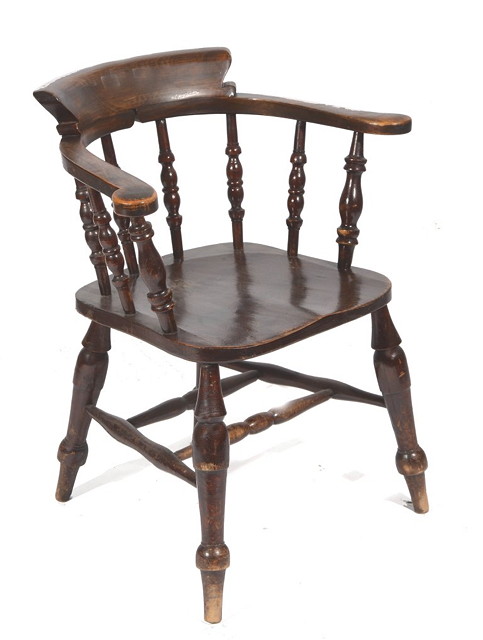 Appraisal: A STAINED BEECHWOOD CAPTAIN'S CHAIR with spindle supports