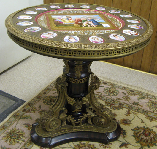 Appraisal: NAPOLEON III STYLE ORMOLU AND PORCELAIN-MOUNTED KINGWOOD CENTER TABLE The