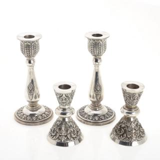 Appraisal: Pair Southeast Asian silver candlesticks Pair Southeast Asian silver candlesticks