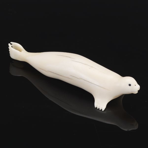 Appraisal: CARVED WALRUS TUSK SEAL x Carved walrus tusk seal figurine