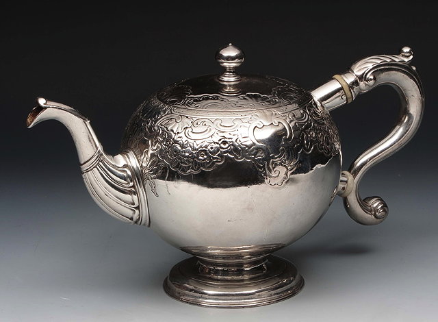 Appraisal: A GEORGE II SILVER TEAPOT bullet shape with chased upper