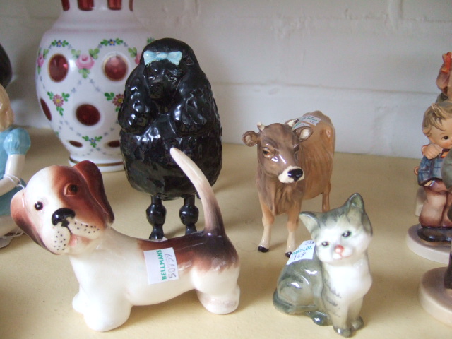 Appraisal: A Beswick poodle a Beswick characature dog a Beswick cat