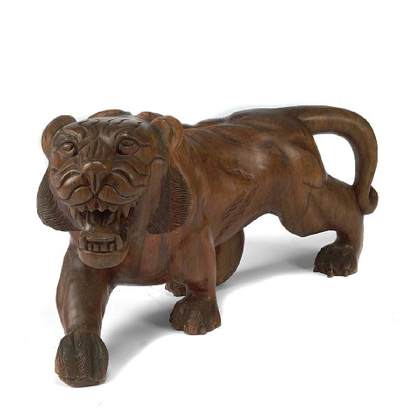 Appraisal: A South East Asian carved wooden tiger height in width