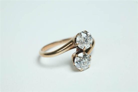 Appraisal: DIAMOND CROSSOVER RING Two old European cut diamonds weigh approximately