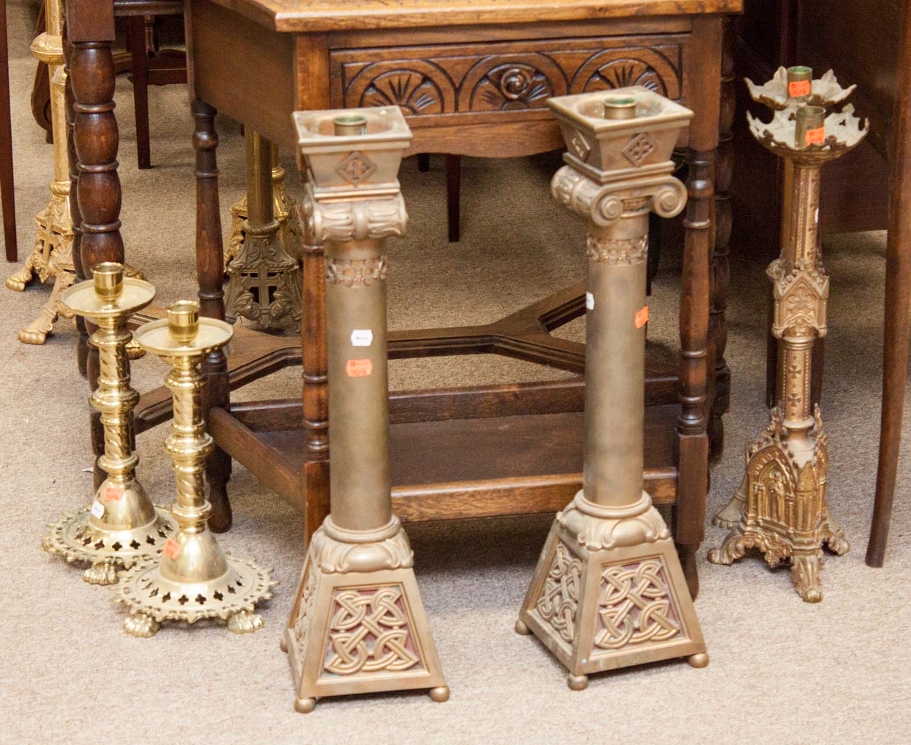 Appraisal: Three pairs of ecclesiastical candlesticks