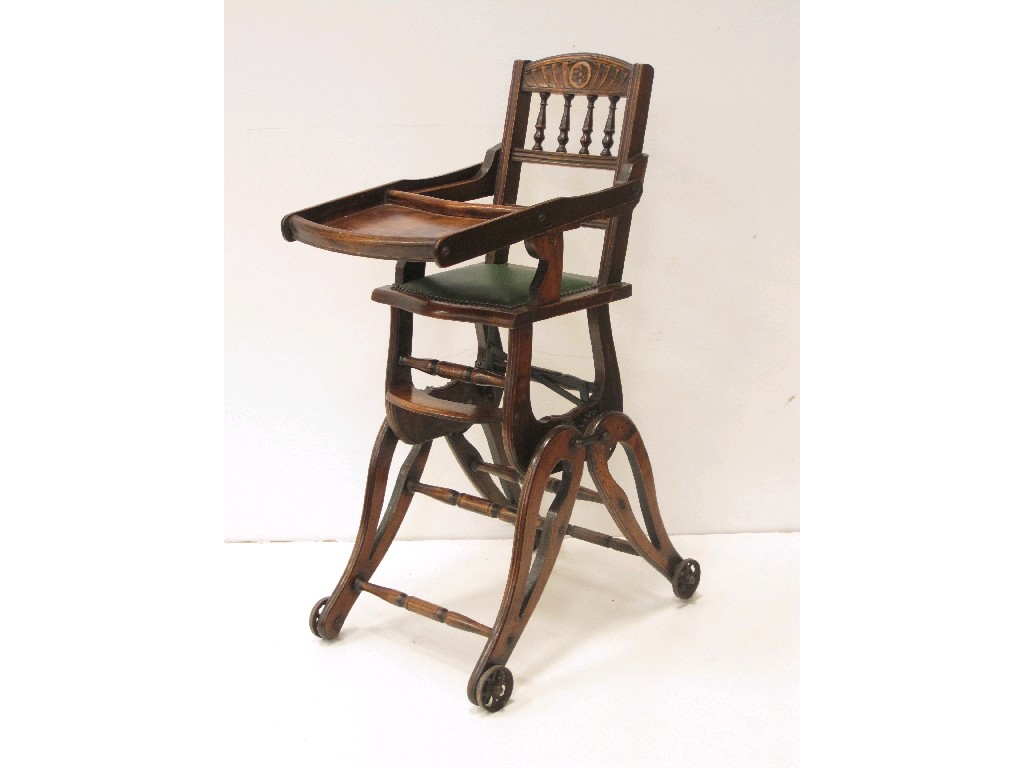 Appraisal: A late th Century stained wood child's folding High Chair