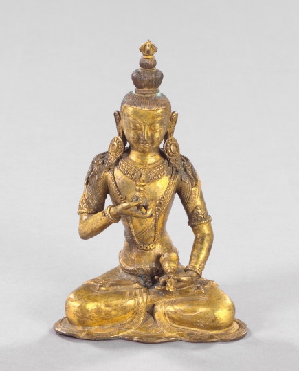 Appraisal: Attractive Sino-Tibetan Elaborately Chased Gilt-Bronze Figure of a Seated Youthful