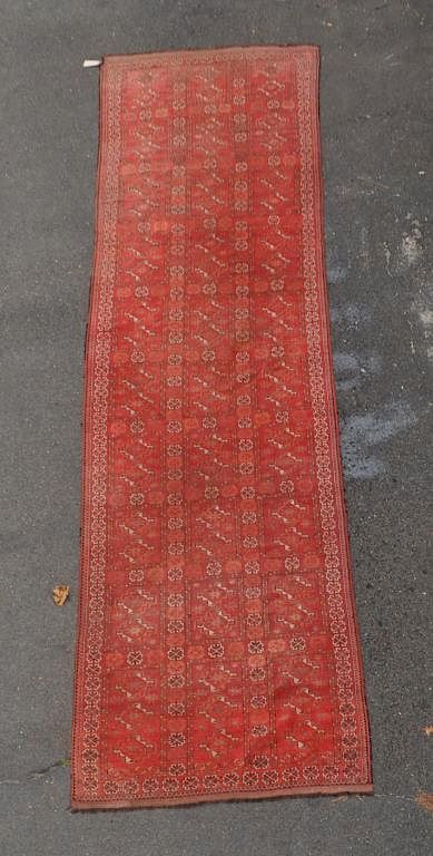 Appraisal: Long Oriental Gallery Rug in red and dark tones '