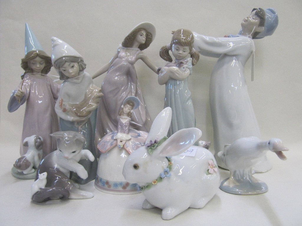 Appraisal: Nine assorted Lladro figures to include girls with animals bell