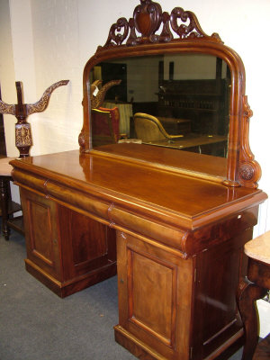 Appraisal: A mahogany pedestal sideboard th century the raised shaped mirror