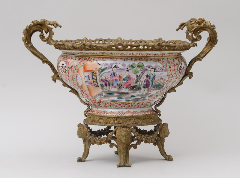 Appraisal: NAPOLEON III GILT-METAL-MOUNTED PORCELAIN CENTERPIECE The oblong bell-form bowl with