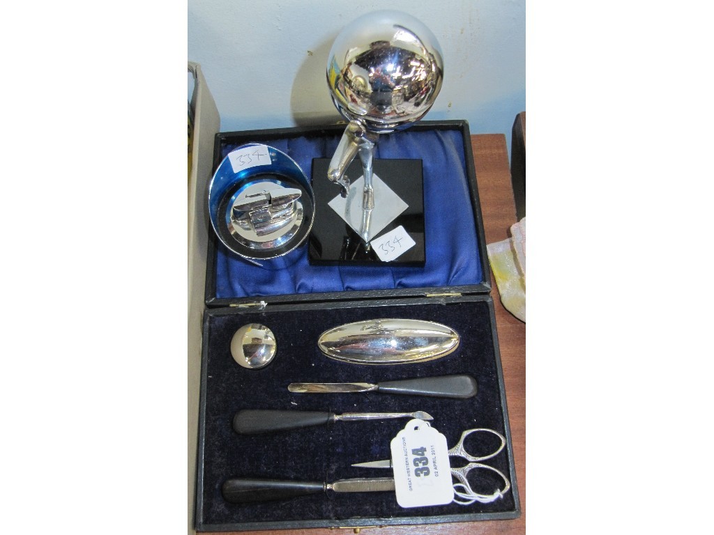 Appraisal: Lot comprising manicure set and two table lighters