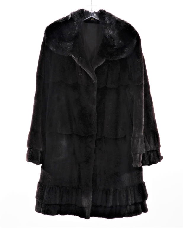 Appraisal: BLACK SCALLOPED FUR WINTER JACKET Long black fur coat with