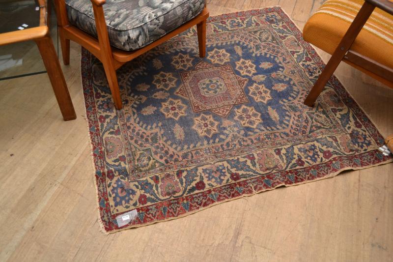 Appraisal: A SQUARE AFGHAN RUG IN RED CREAM AND BLUE TONES