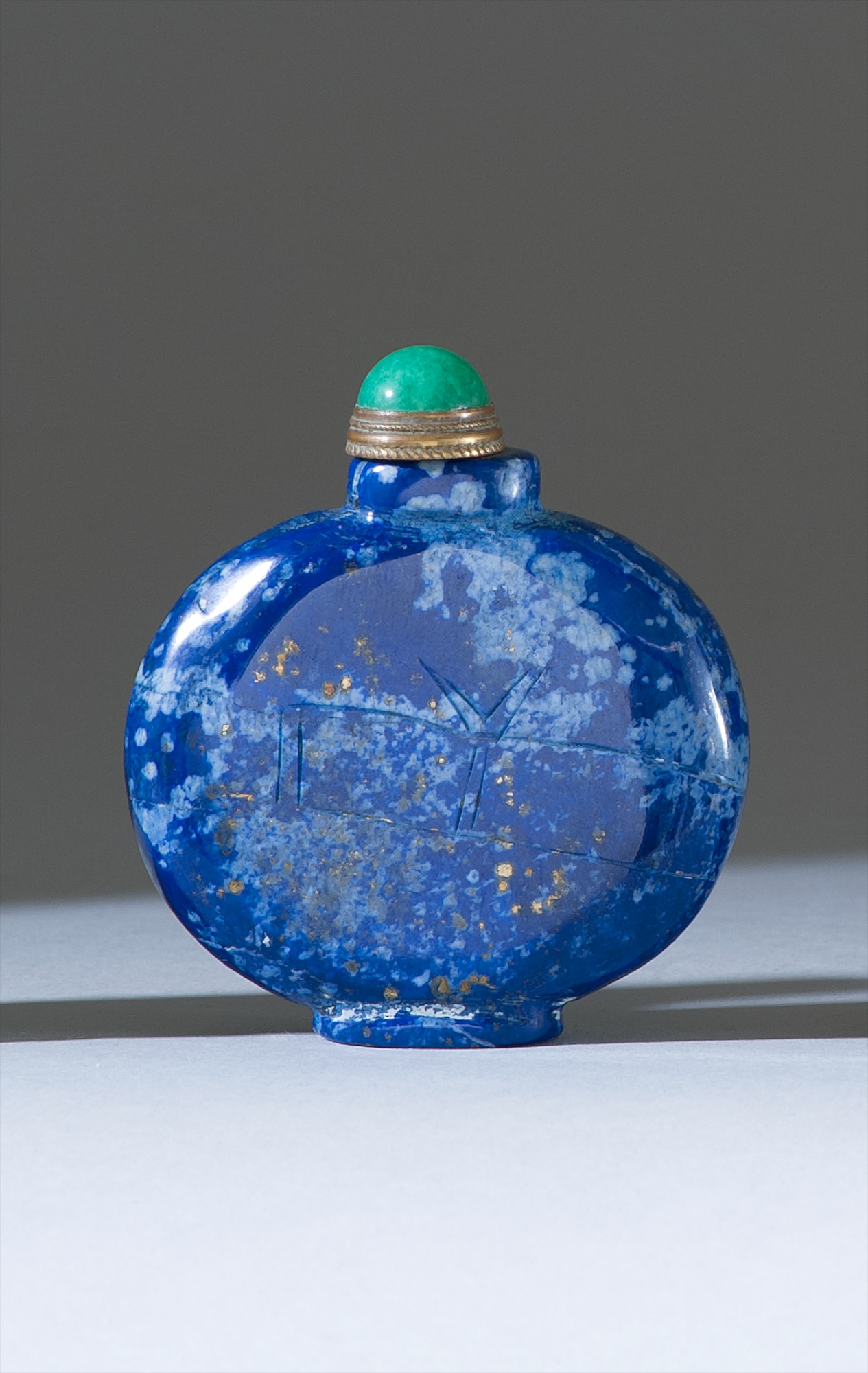 Appraisal: LAPIS LAZULI SNUFF BOTTLE th CenturyIn flattened ovoid form with