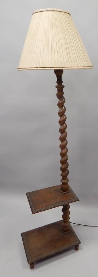 Appraisal: An early thC oak standard lamp with spirally turned column