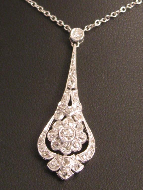 Appraisal: An Art Deco style Diamond Pendant the circular-cut stones millegrain-set