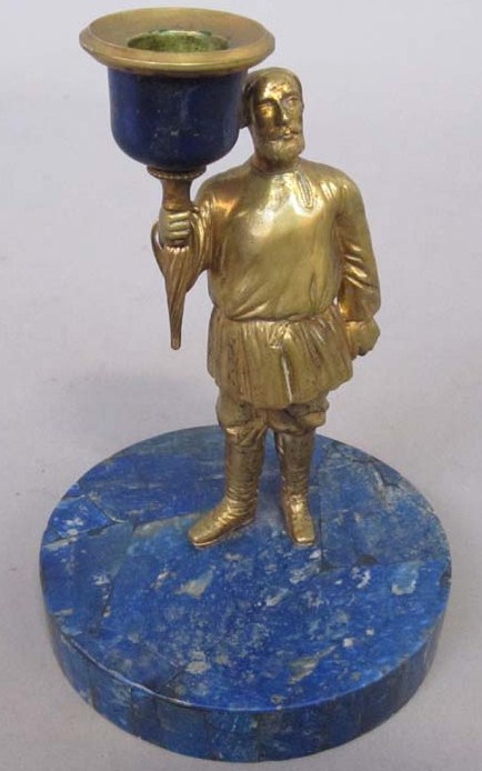 Appraisal: BRONZE FIGURAL CANDLE HOLDER ON LAPIS BASE Gilt bronze Russian