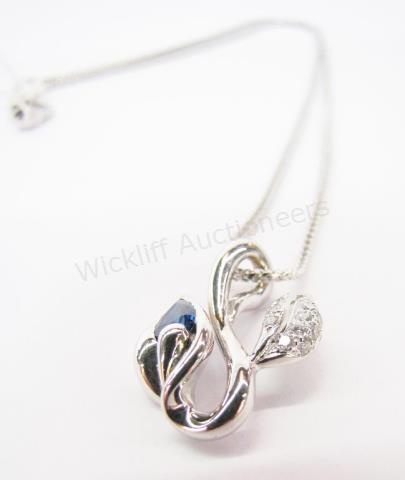 Appraisal: An K white gold leaf design pendant with pear cut