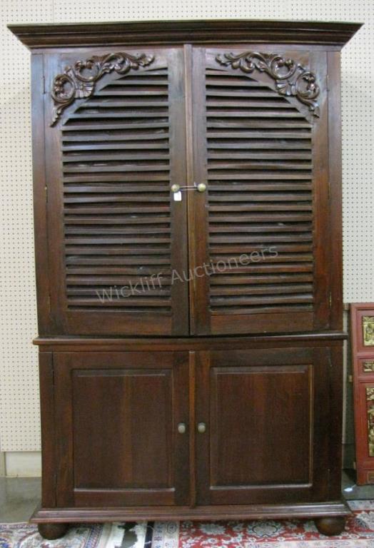 Appraisal: A Bramble Baluster mahogany armoire or linen press with applied